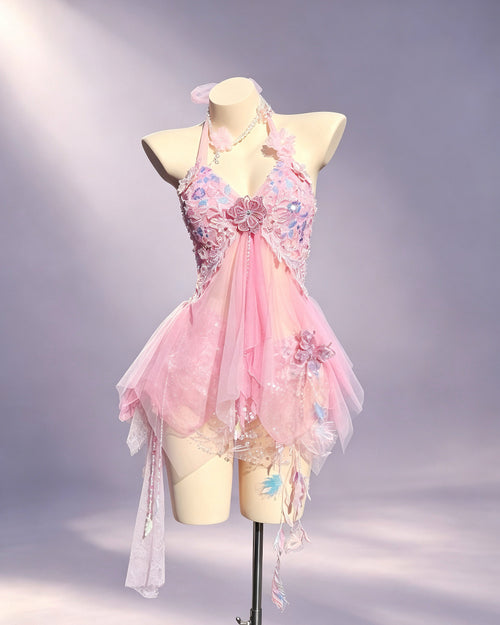 Aster blush pink floral festival set by AVRY with built-in bra top, embroidered wrap skirt and crystal details, front view