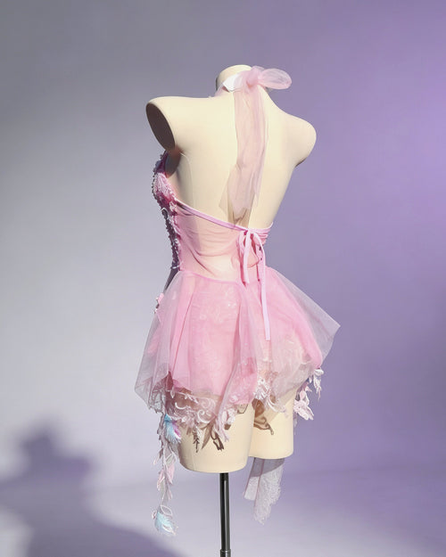 Aster pink fairycore set by AVRY with built-in bra top, sheer wrap skirt and floral embellishments, back view