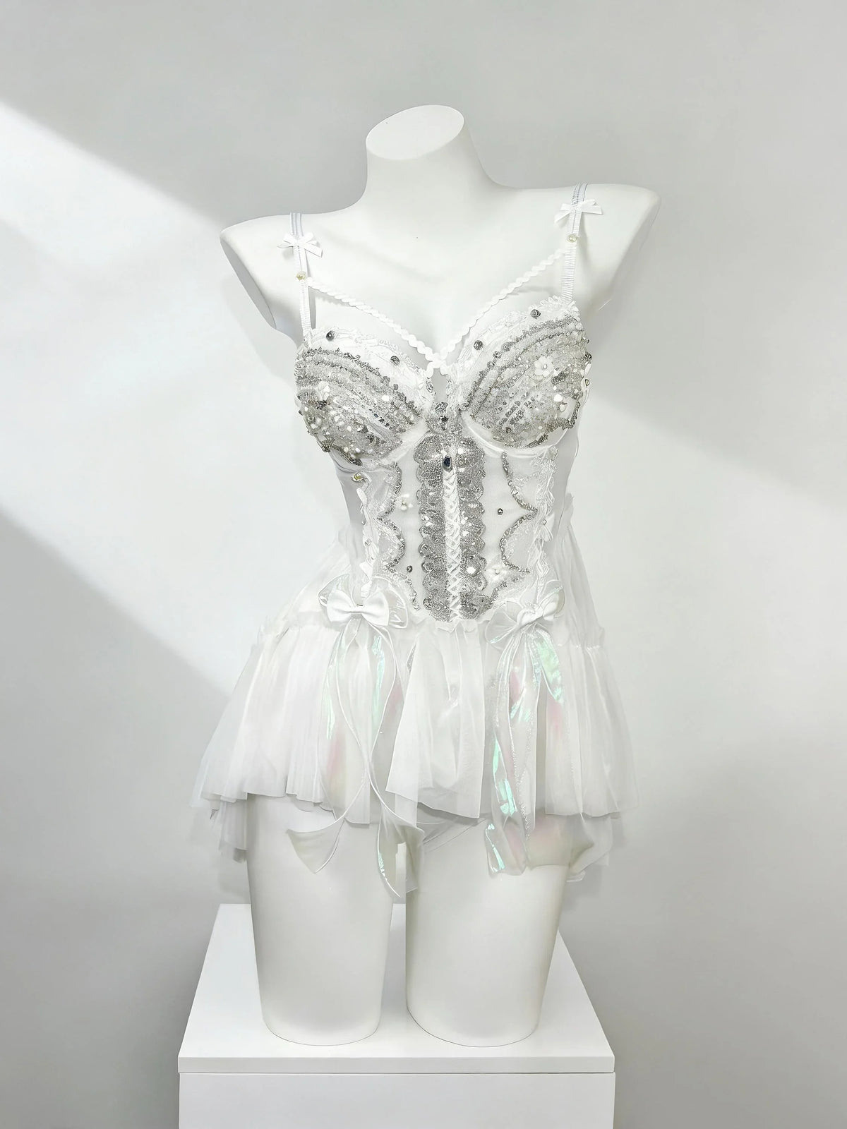 White fantasy rave outfit with layered tulle details by AVRY
