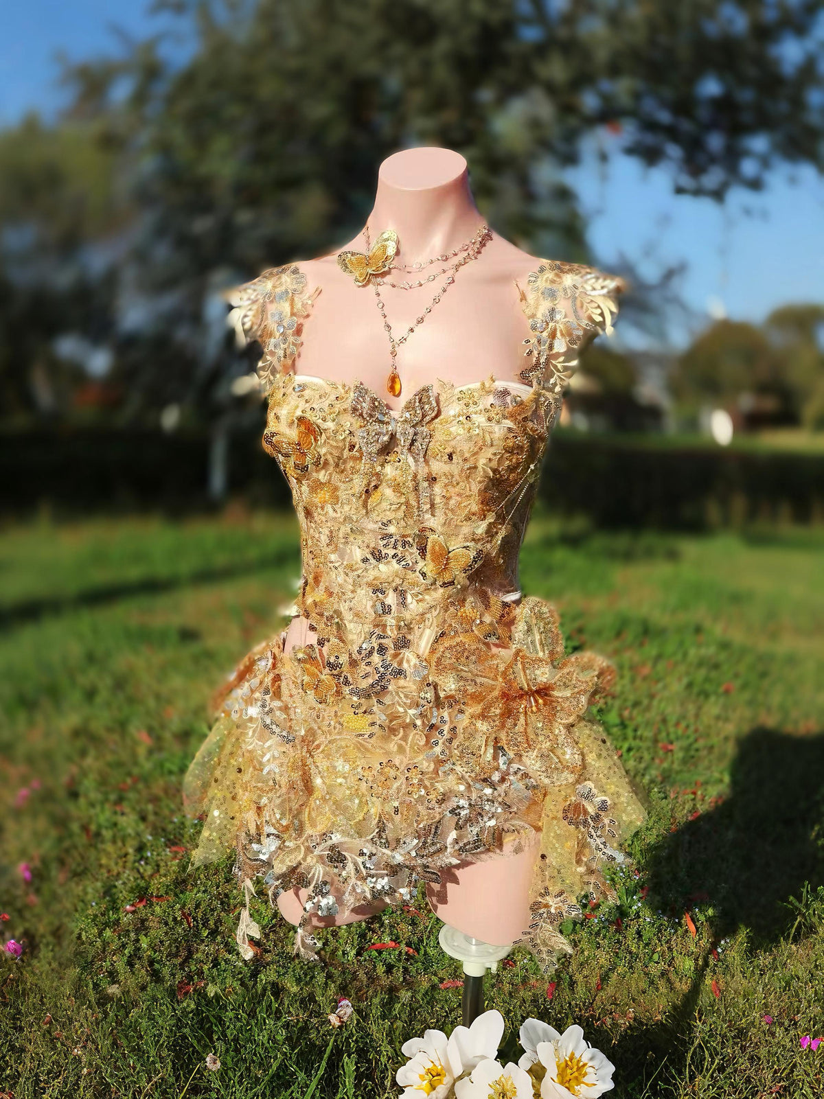 AVRY Rosalind Set gold fairy rave outfit with corset top, skirt-style bottom and layered necklace.