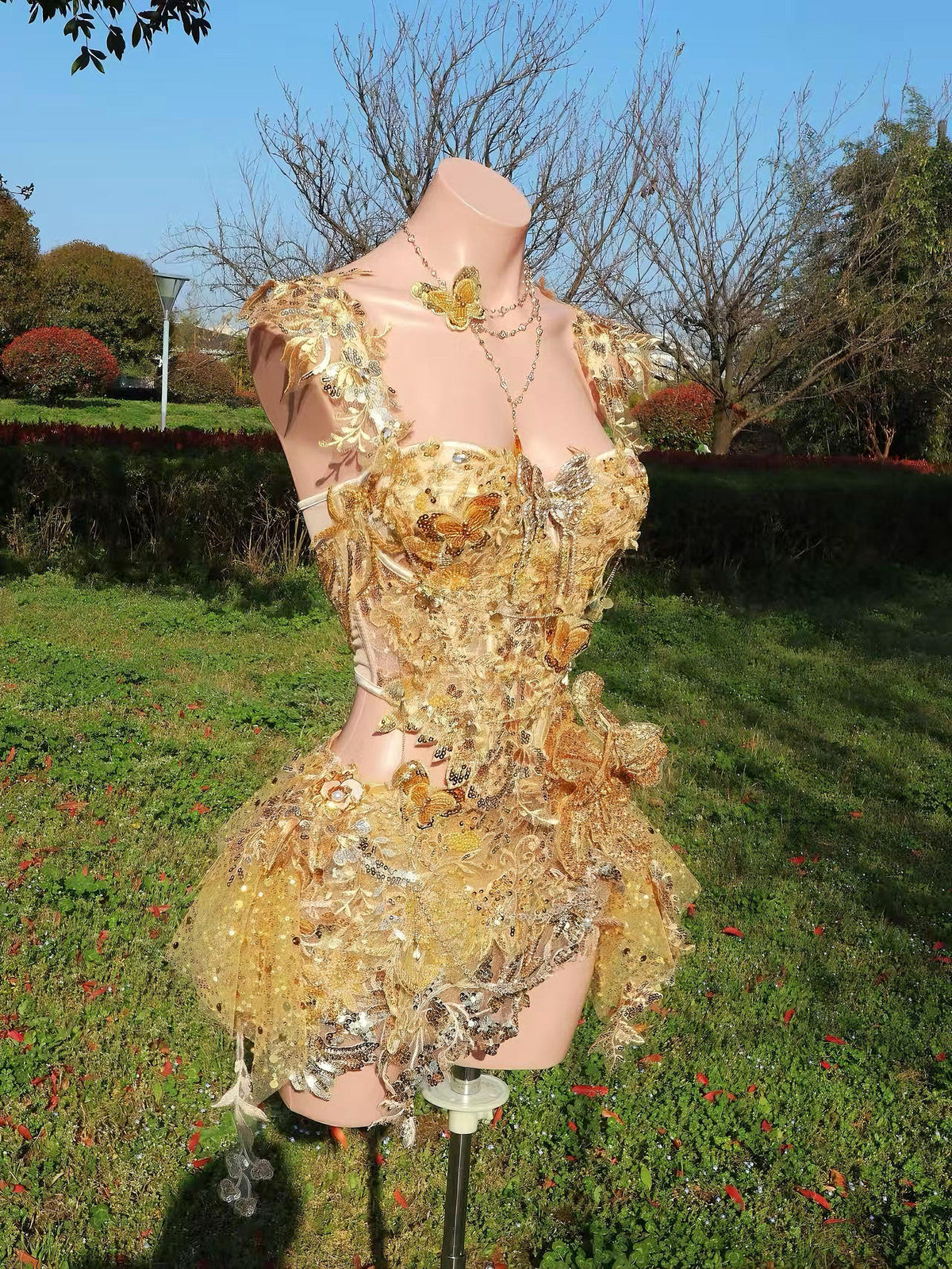 AVRY Rosalind Set side view showing structured gold corset, shimmering sequins and layered festival textures.